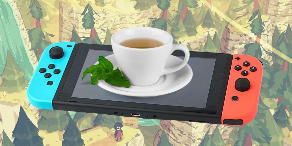 Nintendo Switch with a teacup sitting on it (not recommended) In Front Of A Screenshot from A Short Hike with the main character penguin in the bottom of the screen on a hiking trail