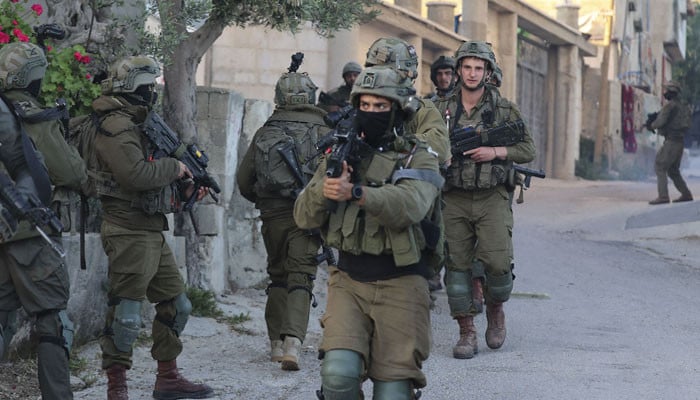 Israeli forces martyr three Palestinians during refugee camp raid