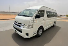 A white Toyota Hiace van, an excellent choice for affordable van rental in Dubai. Ideal for group travel, airport transfers, or commercial use in the UAE.
